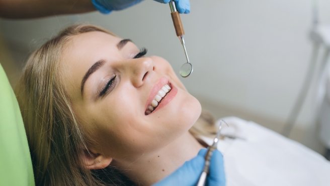 Young woman smiling at dental checkup in Irving