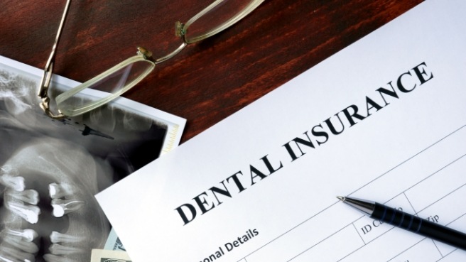 Dental insurance form on table