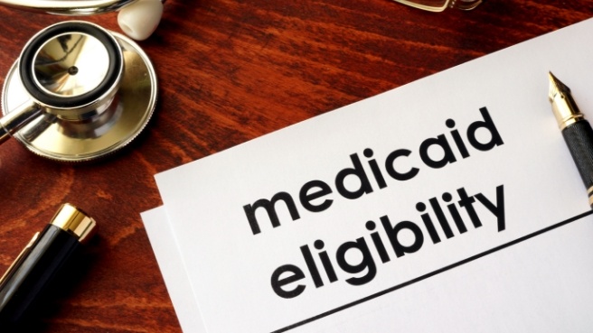 Form on desk that says Medicaid Eligibility