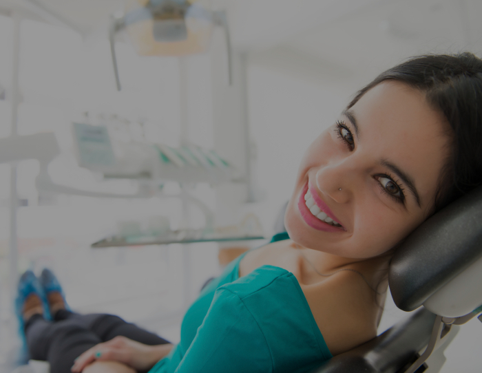 Young woman smiling in dental chair