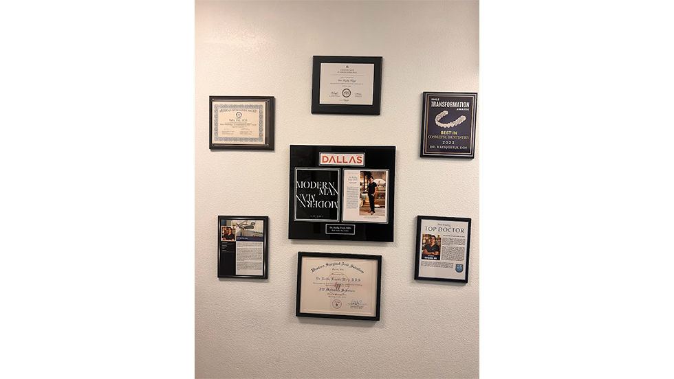Several framed awards and diplomas for Doctor Rafiq