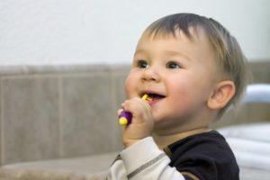 A child brushing their teeth.