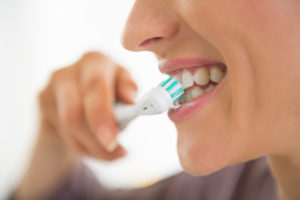 person brushing teeth