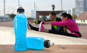 people exercising with sports drink in picture