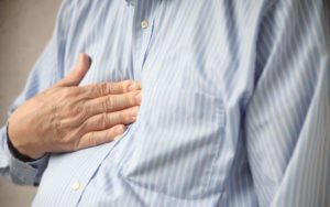 person suffering from acid reflux