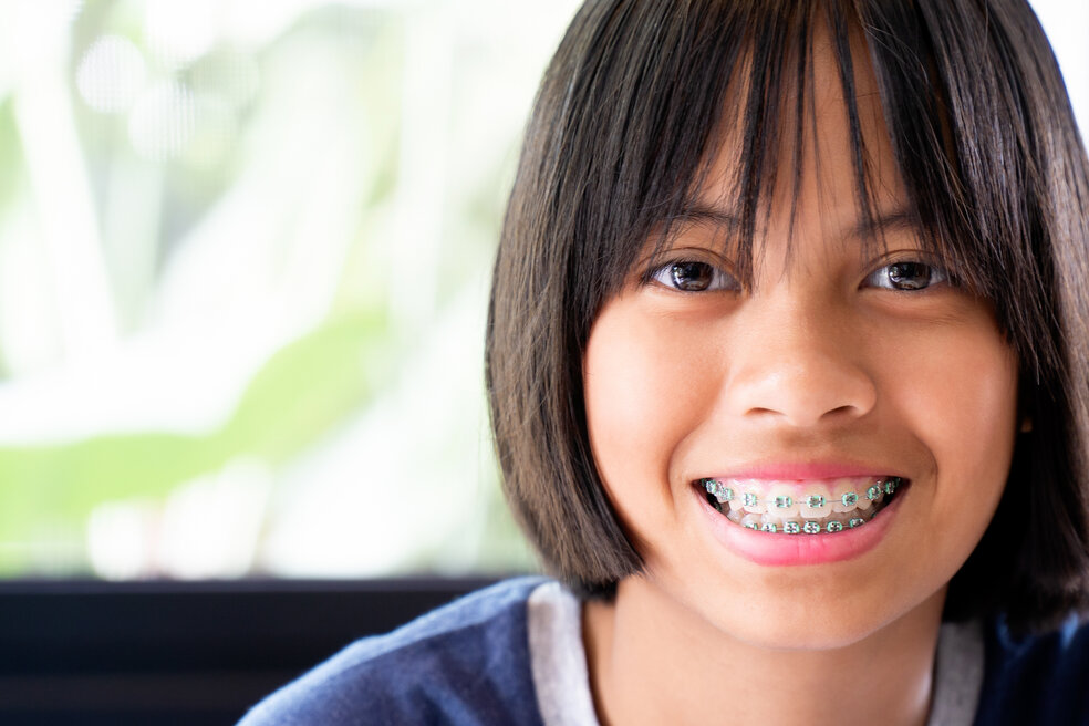 person with braces smiling