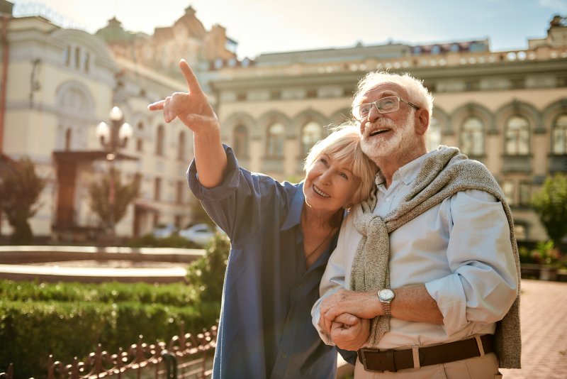 mature couple smiling with dental implants in Irving