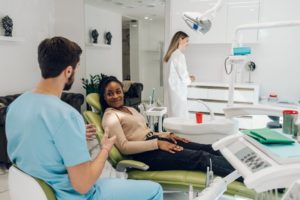 a patient consulting with a dentist about getting dental implants