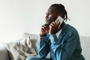 concerned man talking on the phone