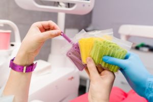 a patient choosing their rubber bands for braces