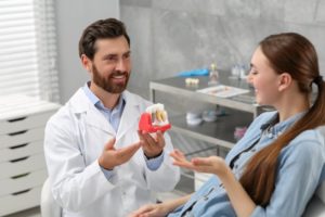 a dentist consulting with a patient about dental implants