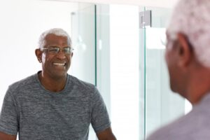 a man smiling in the mirror