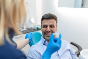 a patient speaking with his dentist about Invisalign